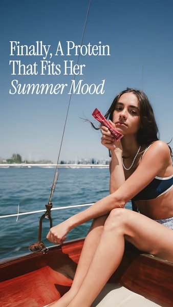 A 9:16 portrait image featuring a person on a sailboat holding a protein supplement stick, using an aspirational aesthetic to promote a specific mood.